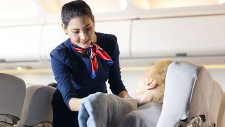 Real reason why cabin crew randomly walk the aisle when everyone's asleep