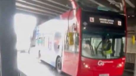Double decker bus roof ripped off after crashing into railway bridge in South Norwood