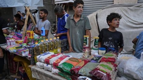 Gangs and merchants sell food aid in Gaza, where Israel’s offensive has shattered security
