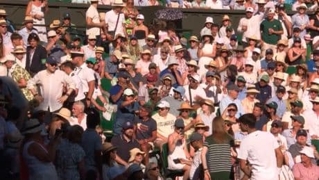 Carlos Alcaraz turns Wimbledon water boy as reigning champ halts marathon match to help a fan in need