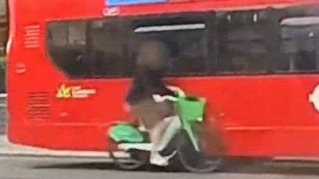 Shocking moment cyclist smashes into bus & flips over handlebars… but viewers can’t work out who’s to blame