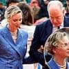 Princess Charlene of Monaco links arms with husband Prince Albert II - as couple exchange fond glances while attending tennis match