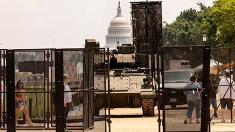 MIKEY SMITH: Nervy Washington DC braces for Donald Trump's tank parade: 'This is f*****g weird'