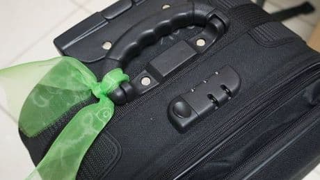 Holidaymakers warned to stop tying ribbons to suitcases 
due to 'major problem'