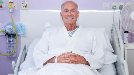 Dr Hilary Jones pictured in hospital bed after huge op as he reveals tip on going private