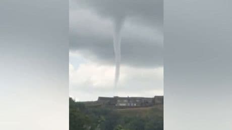 Moment ‘tornado’ swirls over UK village caught on camera