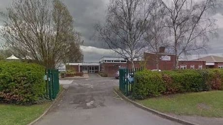 Schools plunged into lockdown as armed cops hunt ‘man with machete’ roaming streets – as suspect, 34, arrested