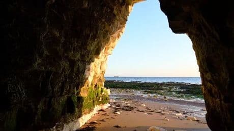 'Fairytale' beach just 2 hours from London with hidden caves unveiled at low tide