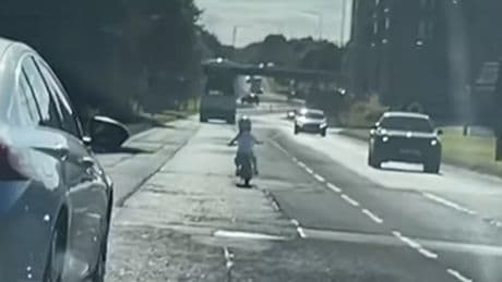 Terrifying clip of child riding bike on busy Scots road sparks fear online
