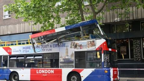 Open-top tourist bus smashes into tree in central London