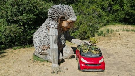 Giant trolls built from trash want to save humans from themselves