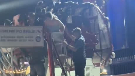 Terrified festival-goers left hanging upside down for 20 minutes after fairground ride breaks down