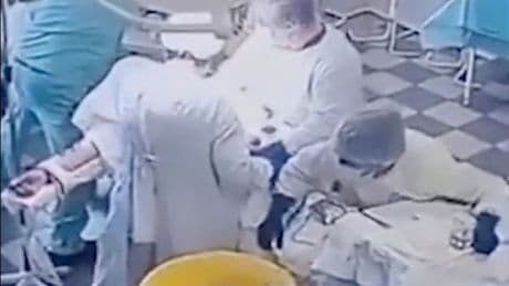 Terrifying moment brave doctors continue surgery during huge 8.8-mag earthquake