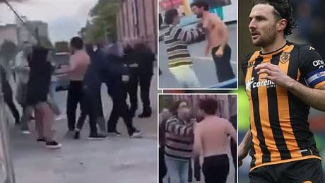 Topless Championship football star is dragged away from bloody 'street brawl' after 'pub row' stopped traffic