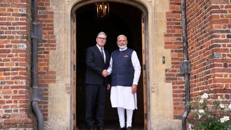 Photos of Britain's Starmer and India's Modi sealing a major trade agreement