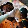 Athletics beat Reds 3-0 as Carlos Cortes hits 2 homers