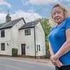 Neighbours at war over 'one inch of land' after couple knock down boundary fence in picturesque village