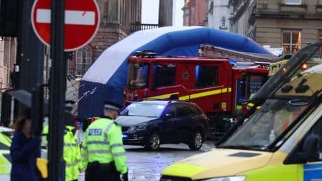 Liverpool parade crash: Fire crews battle to lift car off four trapped people including child