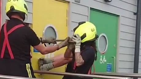 Woman stuck inside locked public toilet needs fire crew rescue after door malfunction