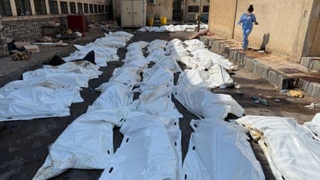 Rows of decomposing bodies that can't be buried because of fierce fighting in Syrian city