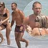 Vogue Williams wears a cut-out bikini as she packs on the PDA and frolics in the sea with shirtless husband Spencer Matthews on holiday in Spain
