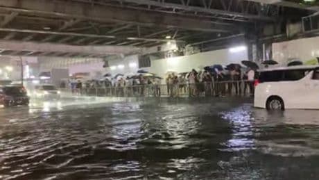 Japan record rainfall submerges roads in water as drivers wade through severe flooding