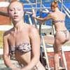 Boris Becker's model daughter Anna Ermakova sets pulses racing as she shows off toned figure in skimpy bikini while taking a dip in Monaco