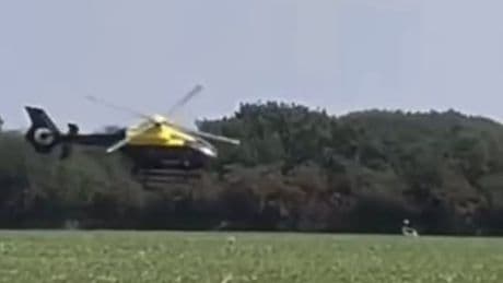 Police helicopter swoops scarily close to ground in motorbike chase