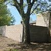 Neighbours at war with council after extending gardens by NINE FOOT by building illegal wall to 'protect them from yobs'