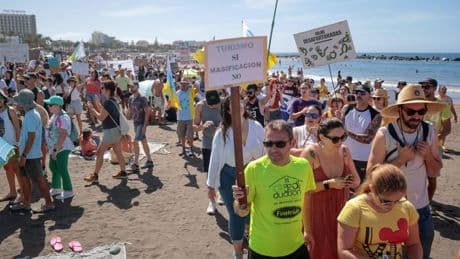 ‘Tourists swim in s***’: Thousands protest against mass tourism in Canary Islands