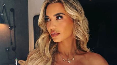 Christine McGuinness strips topless and covers up with towel in sexy bedroom snaps