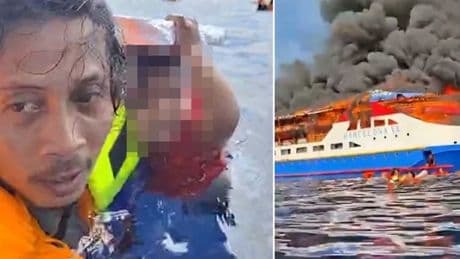 Indonesia ferry fire: Moment man clings to terrified baby in sea after abandoning ship