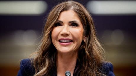 Kristi Noem faces angry protests as she collects doctorate at South Dakota university