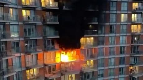 Huge fire erupts opposite O2 arena as flames pour from tower block