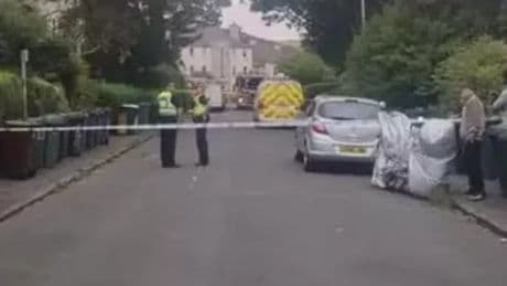 Two men arrested after 'firearm sighting' following flat blaze in Edinburgh