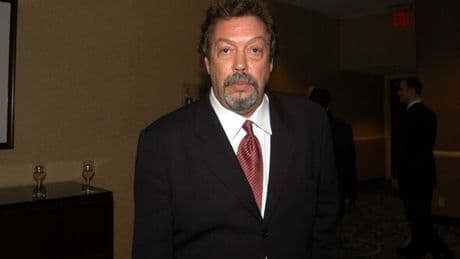 Tim Curry unrecognisable in rare appearance after stroke as he's pushed in wheelchair