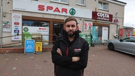 Sickening racist attack caught on camera as teen girl hurls abuse at shopkeeper