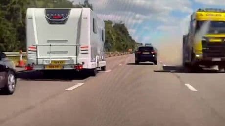 Lorry filmed speeding towards oncoming traffic on M5 before narrowly missing Porsche
