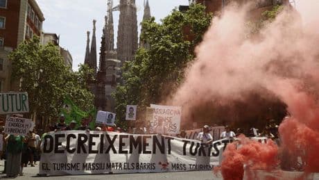 Holidaymakers sprayed by water pistols in Barcelona as part of organised anti-tourism protests across Europe