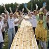 Core blimey! Apple strudel chain stretching 3km and made with five tonnes of flour and fruit clinches world record back from rival Croatian town