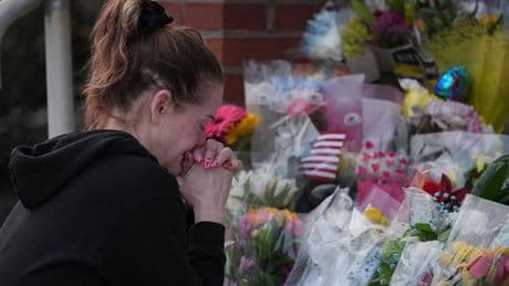 Prosecutor says officer killed in gunman's Pennsylvania hospital attack was hit by fire from police
