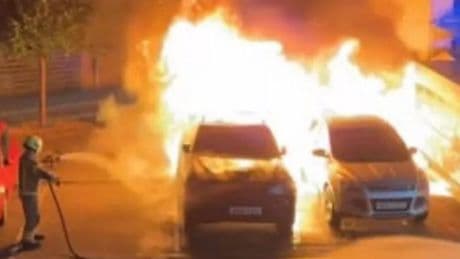 Terrified locals watch on as flames rip through three vehicles on Scots street