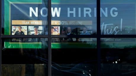 The number of Americans filing for jobless benefits last week rises to highest level in eight months