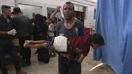 74 killed in Gaza as Israeli forces strike a cafe and fire on people seeking food