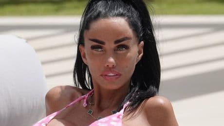 Katie Price unveils 'excruciating' new bum with bloody plasters by pool