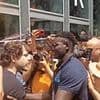 Moment furious hotel worker fights back against crowd of anti-tourism protesters as they seal off his business in Barcelona and bombard it with water guns and smoke canisters