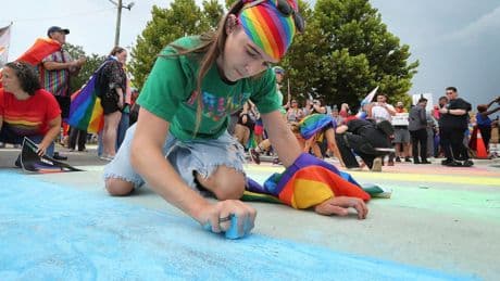 Advocates use chalk to color in rainbow crosswalk near Pulse nightclub that was removed on Trump’s order
