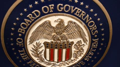 Gold hits record, stocks mixed as Trump fuels Fed fears