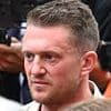 Tommy Robinson pleads not guilty to harassment causing fear of violence against two Mail journalists and opts for a jury trial