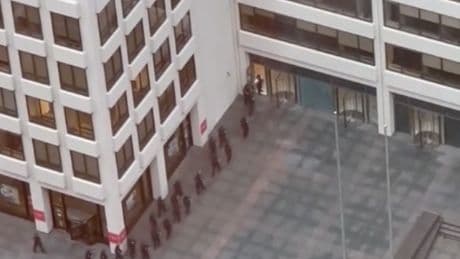 Police descend on New York City skyscraper after police officer and three others killed in Manhattan shooting